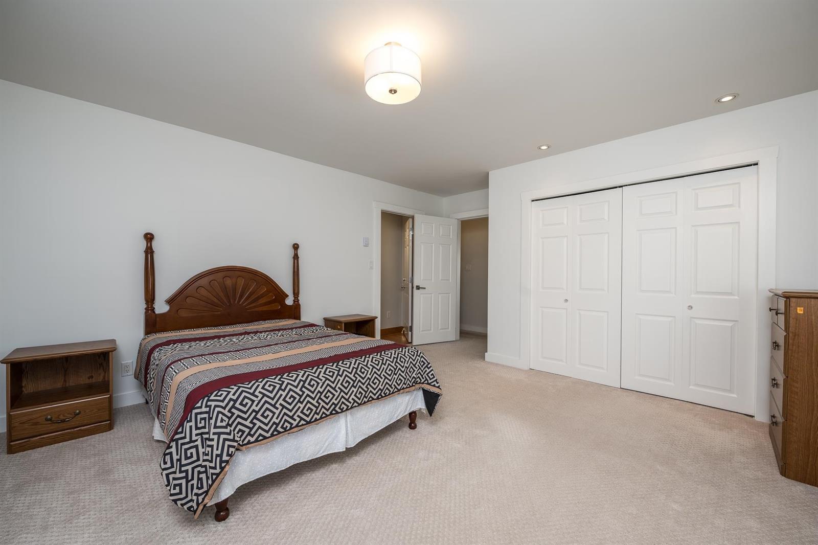 A fourth bedroom with fitted closets.