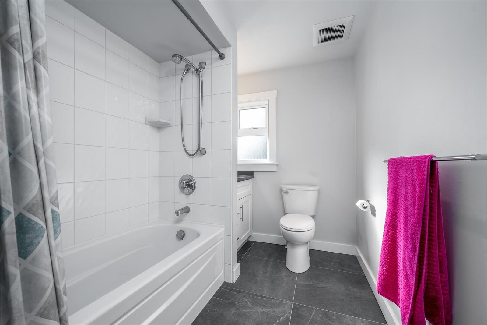 The upper bathroom, a tub under the shower.