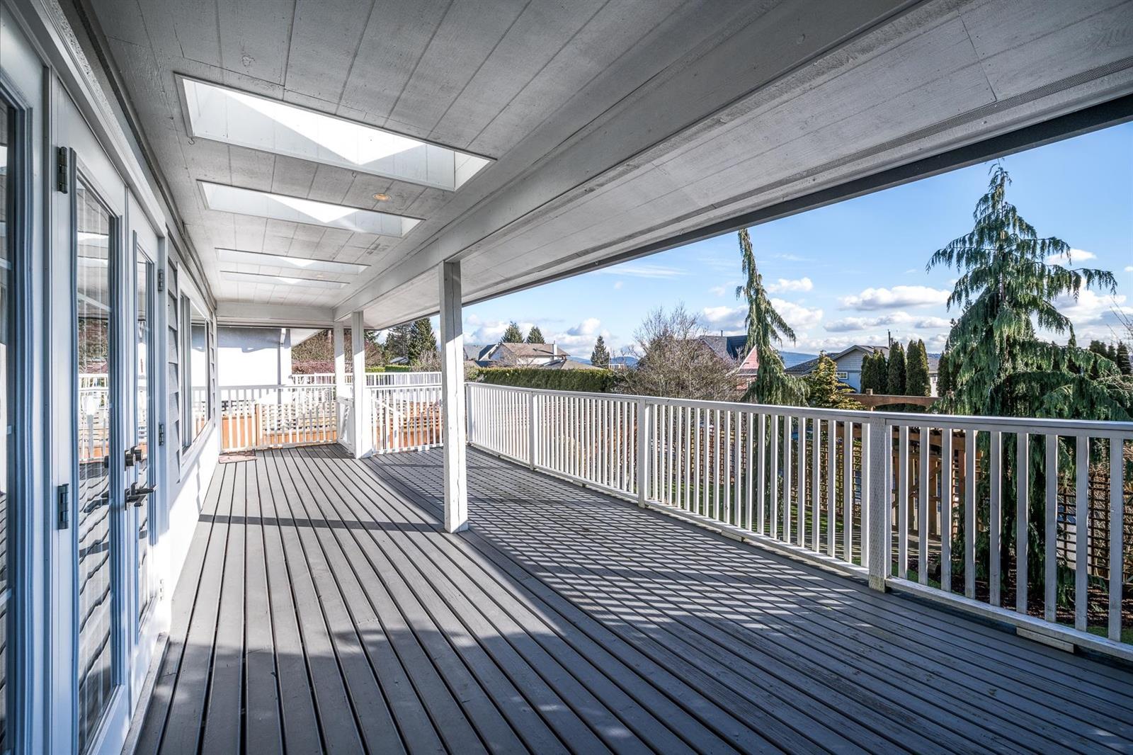 The deck running the length of the rear elevation.