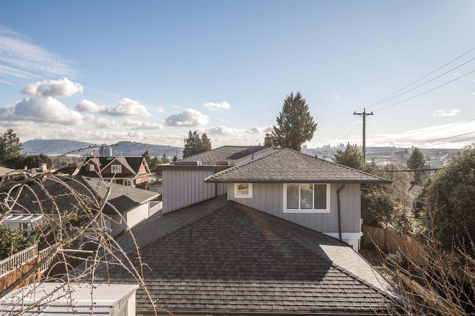 South-east over the neighbouring roofs toward the inlet.