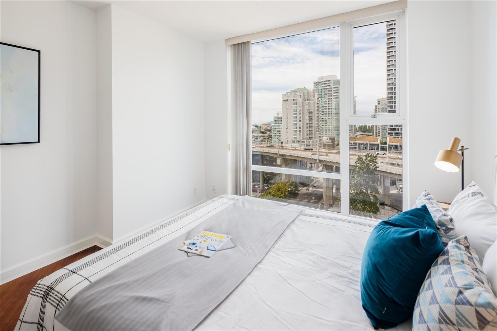 The bedroom corner, the windows looking down over the park.