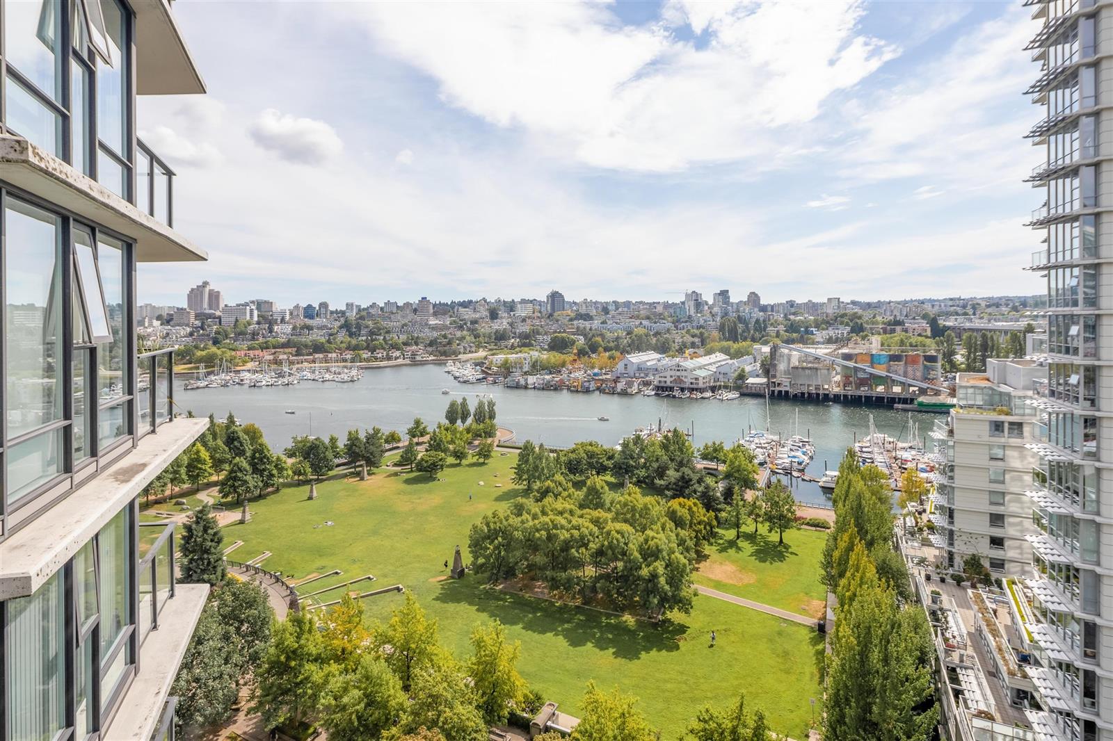 The view from the balcony, the park below and False Creek opening past it.