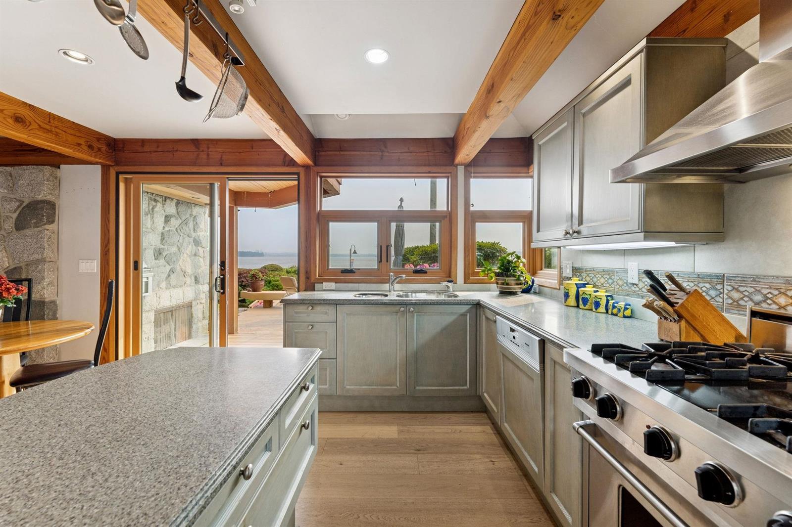 The kitchen counters and range from the far end of the room.