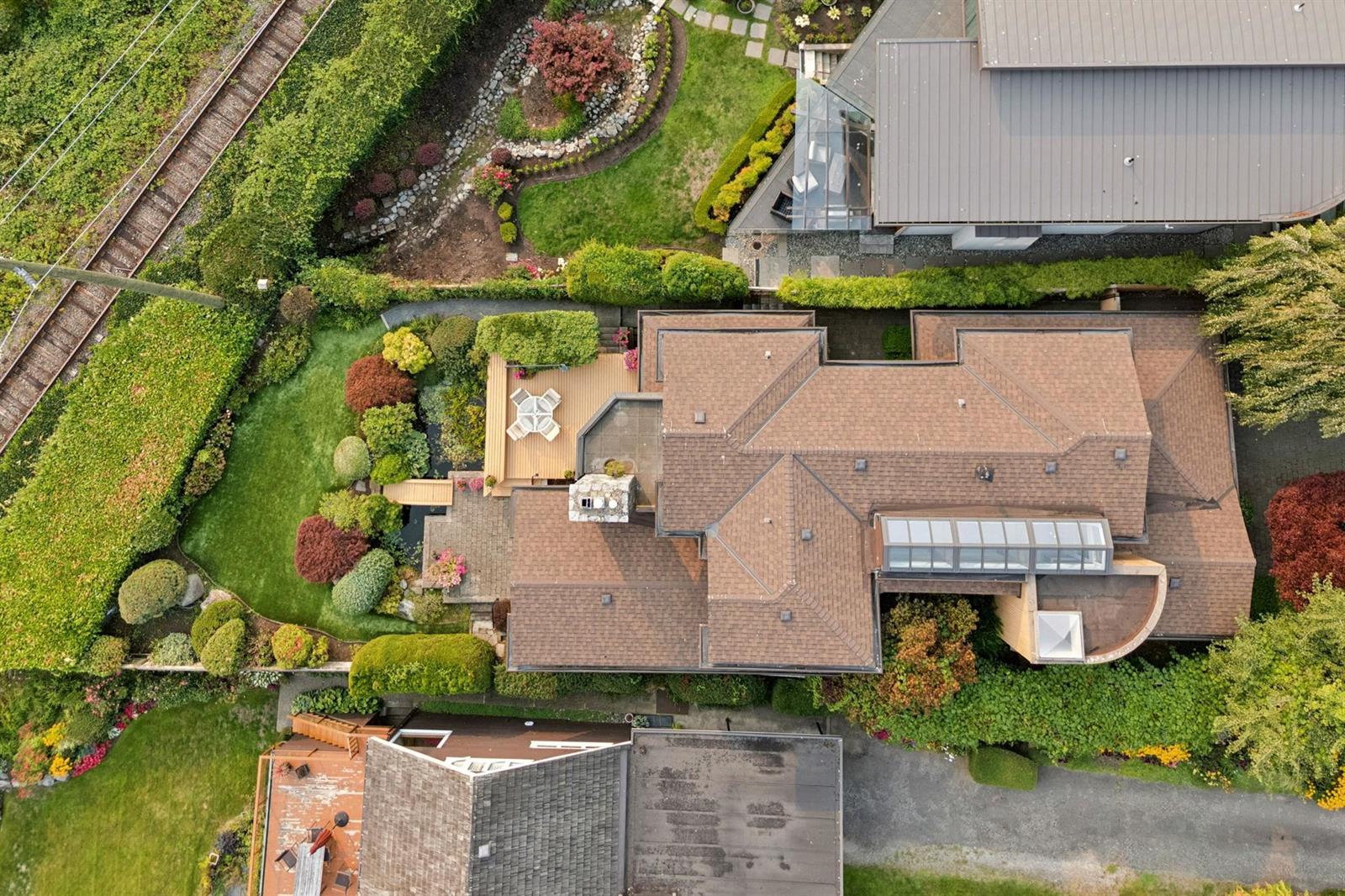 An aerial view straight down onto the roof and the garden between the houses.
