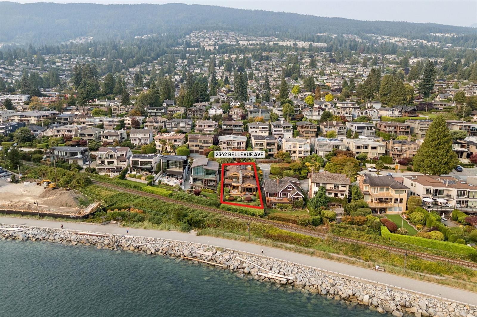 An aerial view out over the water from above the house, the ocean filling the frame.