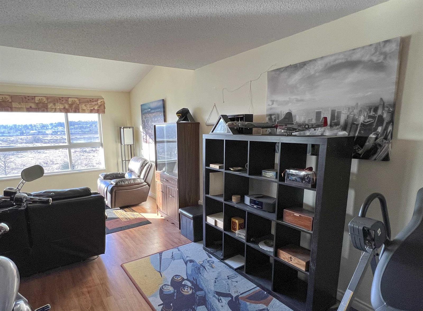 The living area, a window along one wall looking out over the view.