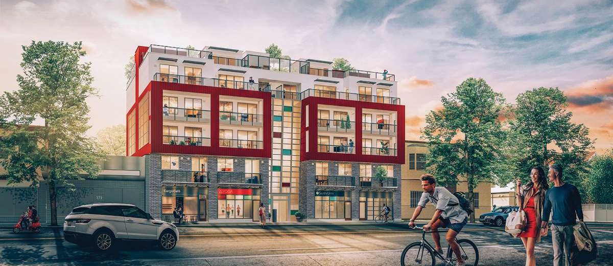 The developer's rendering of SYNCHRO from East Broadway, red-framed balconies above the shops at street level.