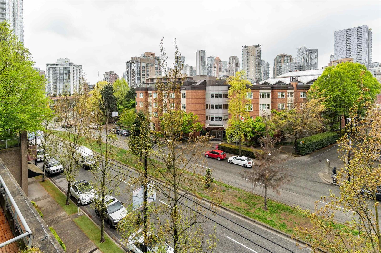 The view from the balcony down a treed stretch of Cambie Street.