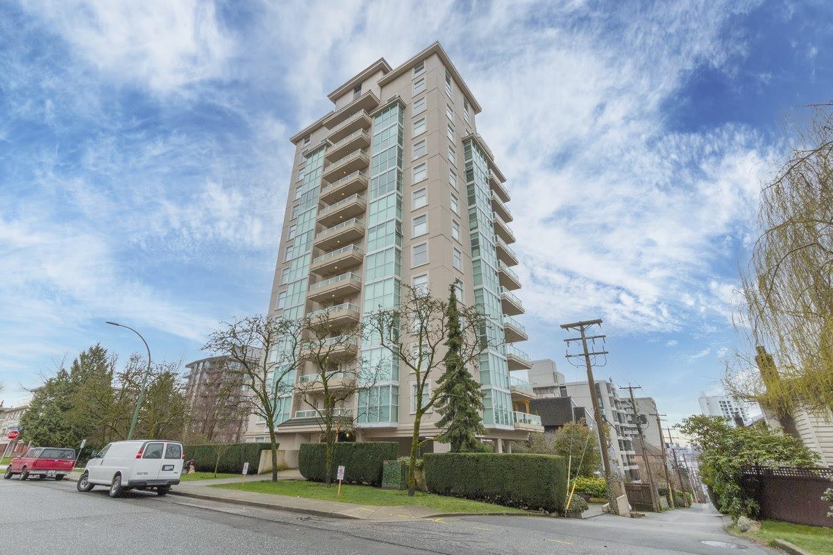The building from Lonsdale Avenue, pale concrete standing above the trees.