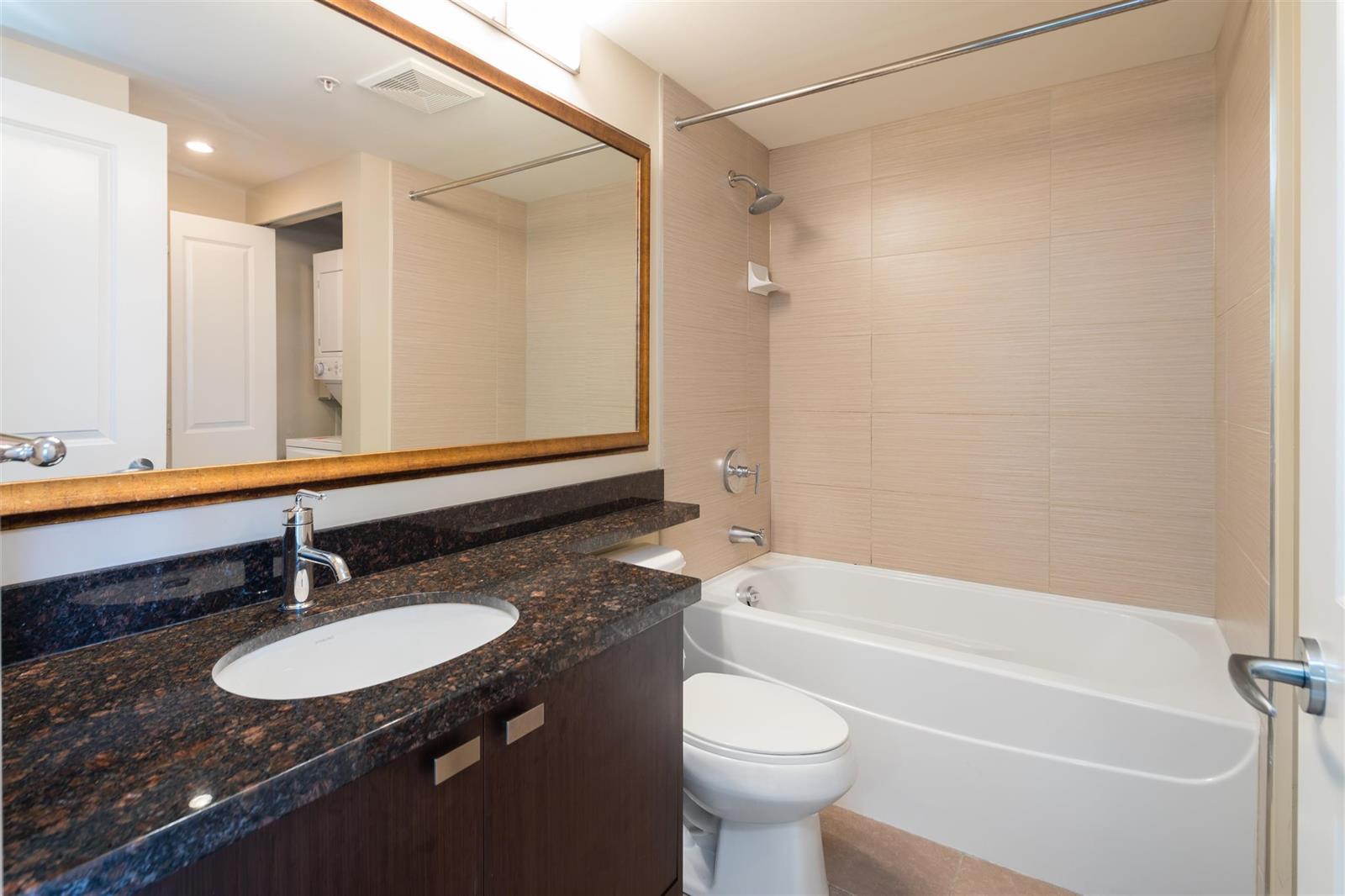 The other bathroom, a long vanity beside the tub.