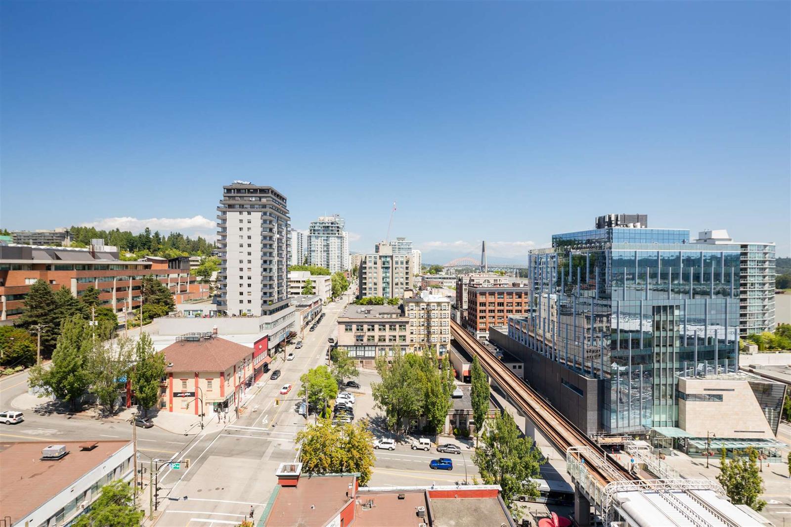 The view across downtown New Westminster, the rail line and the buildings along it.