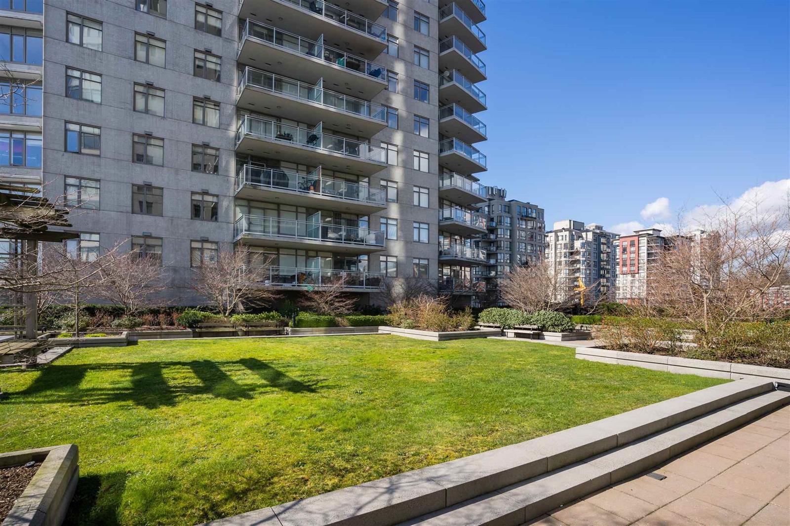 The building's garden terrace, a lawn laid between the towers.