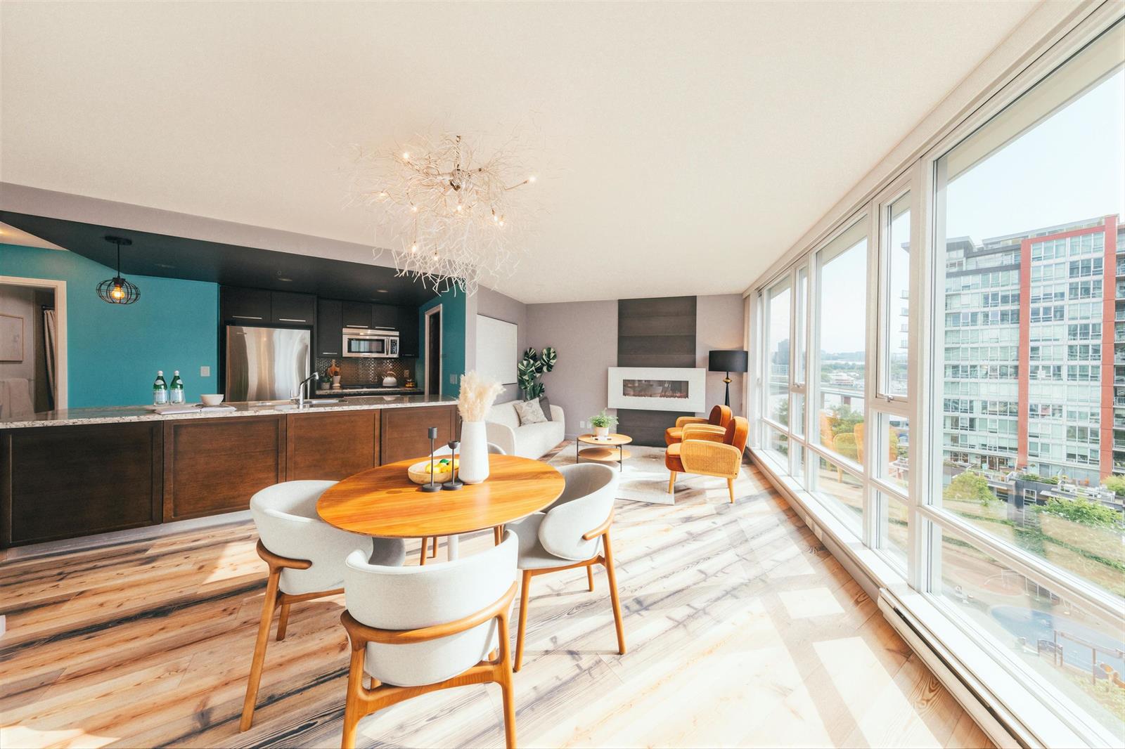 The kitchen and dining area along the window wall, seen from the far end.