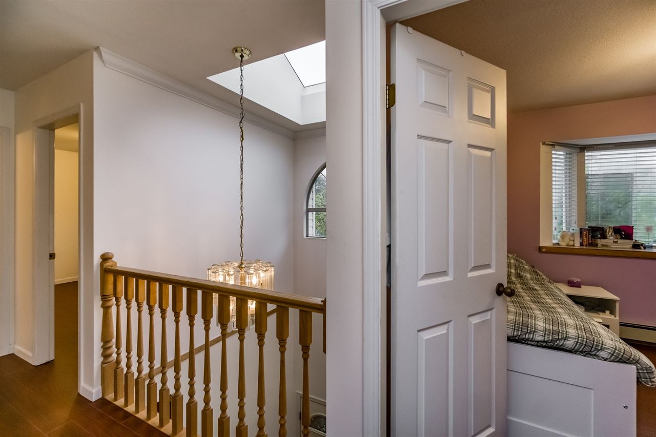 The landing from above, the banister and the skylight over the stairwell.