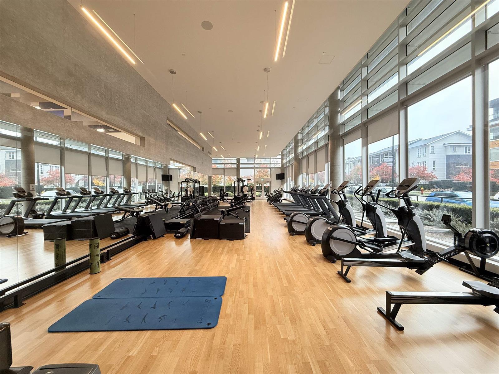 The fitness centre, cardio machines along the full length of the glass.