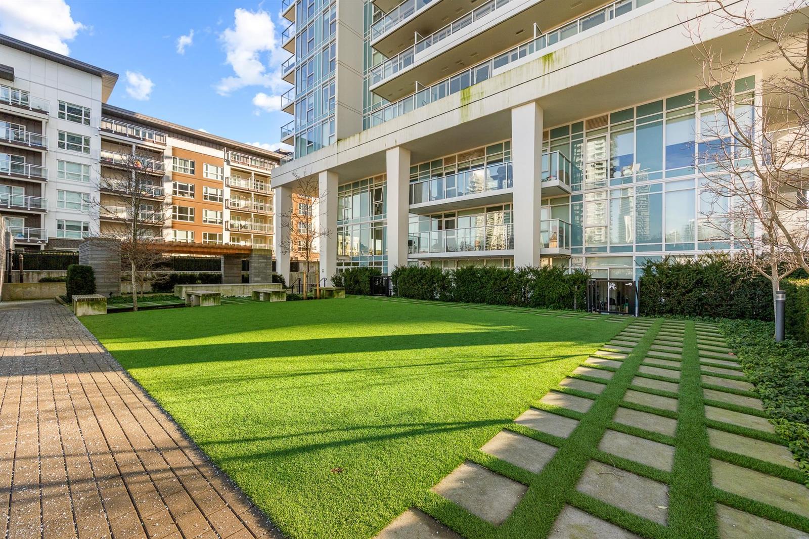 The lawn on the podium, paving stones set through the grass.