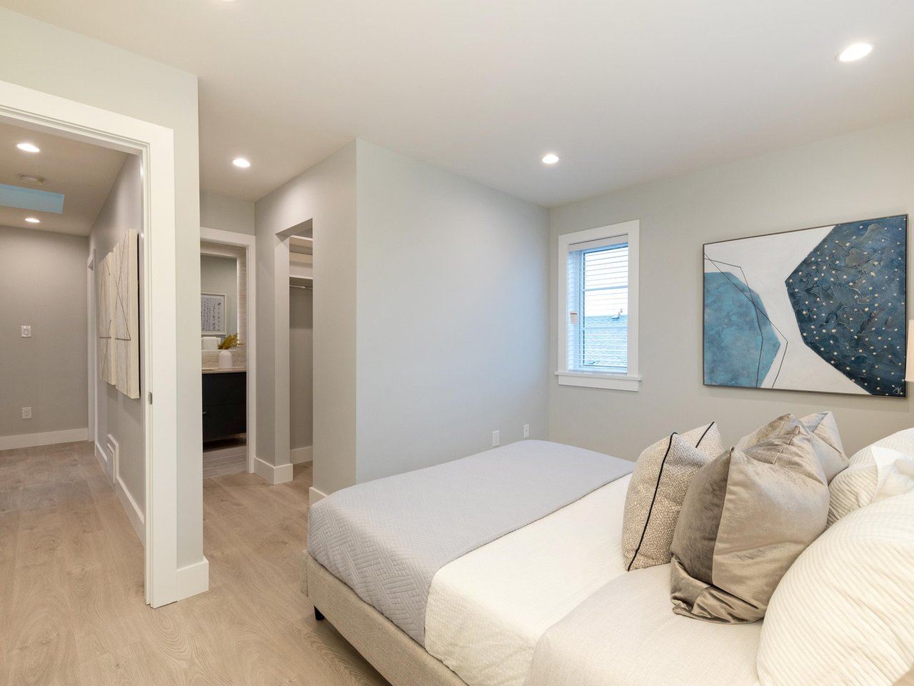 The second bedroom, the doorway through to the hall and the bathroom past it.