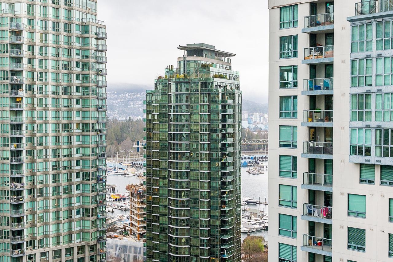 The wider outlook from the windows, towers in the foreground and the North Shore mountains behind.