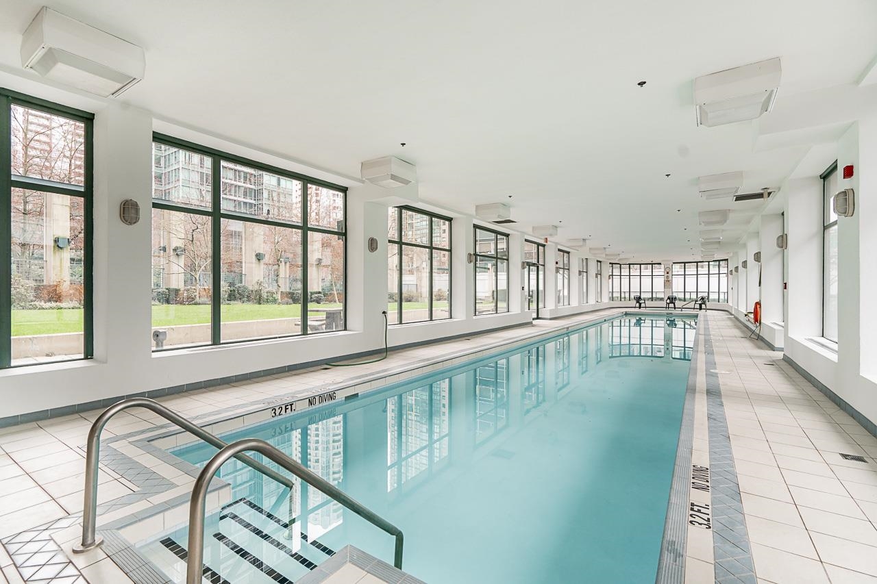 The indoor swimming pool, glass along one wall looking out to the courtyard garden.