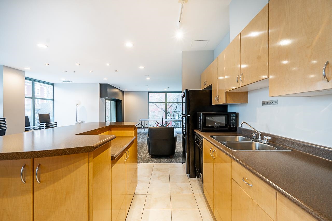 The party room kitchen, cabinetry and counters ready for an event.