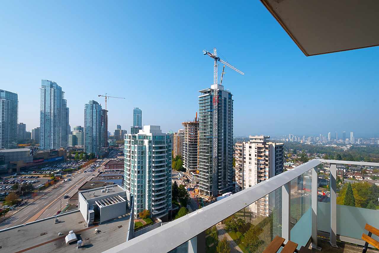 West from the balcony, the towers of Metrotown rising in the near distance with cranes still working among them.