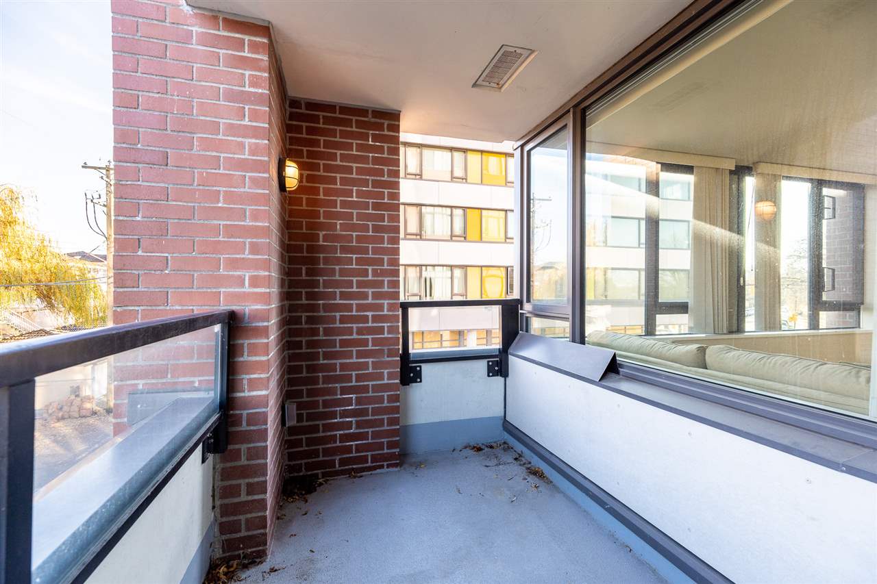 The balcony looking the other way, brick pier and glass rail.