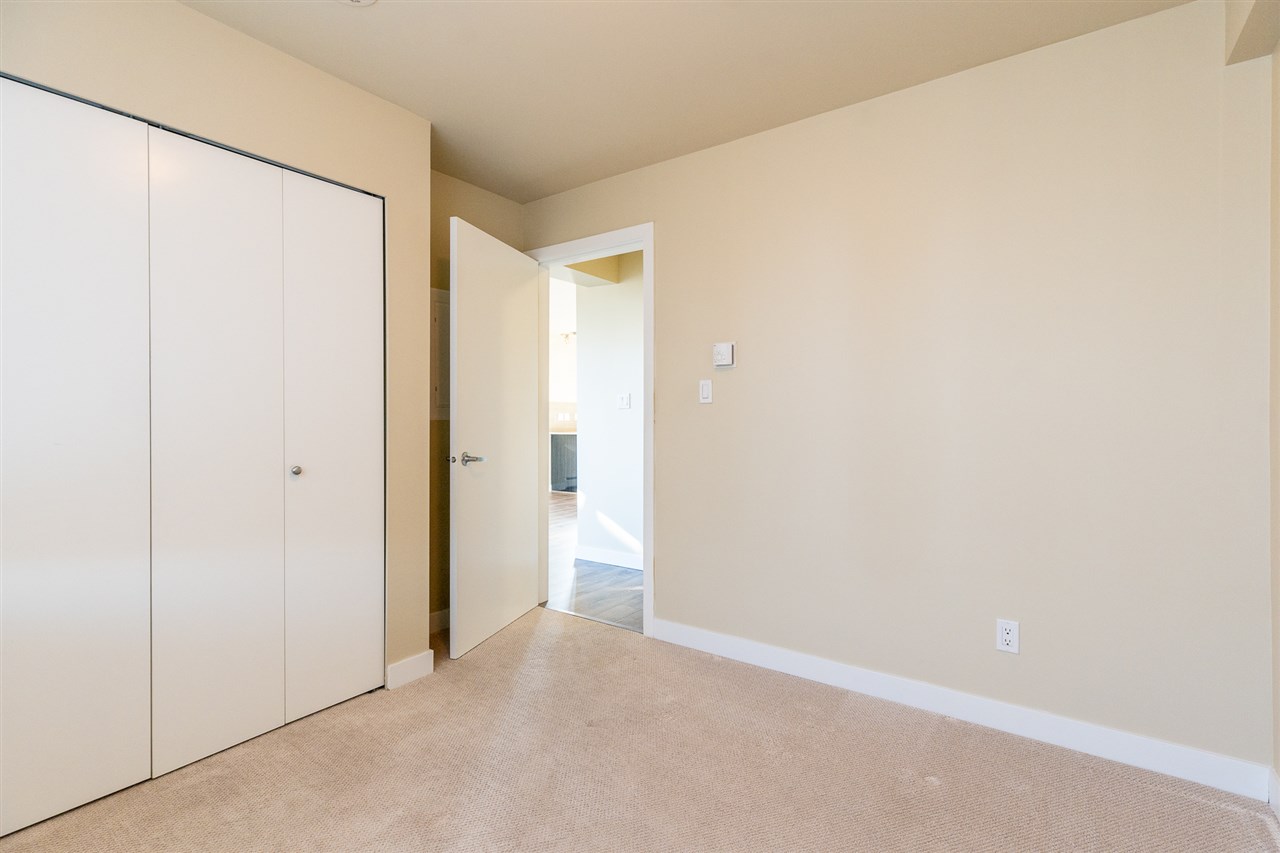 The second bedroom from the corner, the closet along one wall.