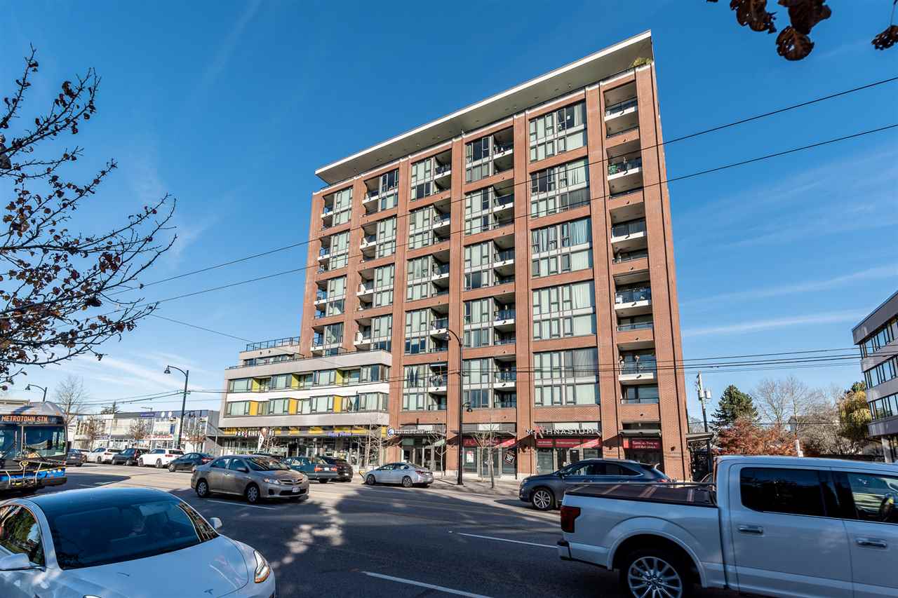 The building from further along the street, eleven storeys above the corner.