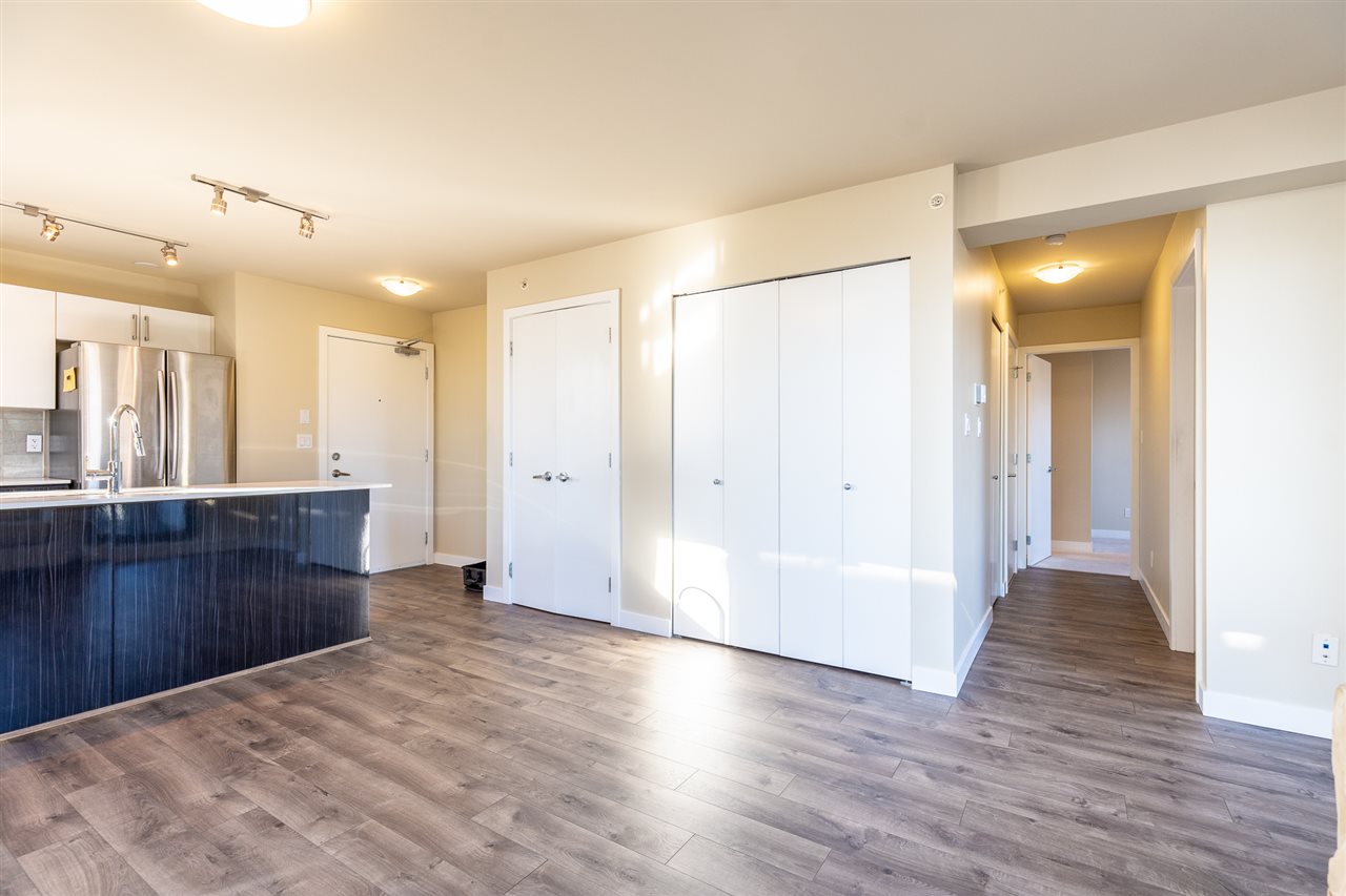 The hall off the living room, closet doors along one side.