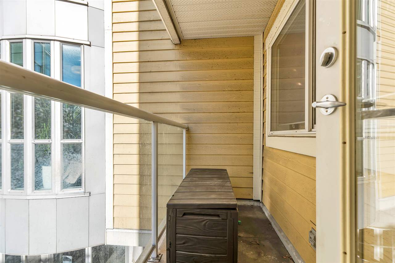 The covered patio off the bedroom, running along the side of the building.