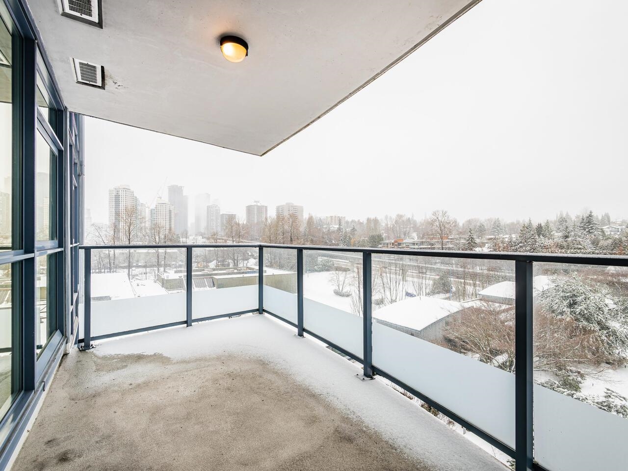 The covered deck, looking out over snow-covered roofs to the towers along the skyline.