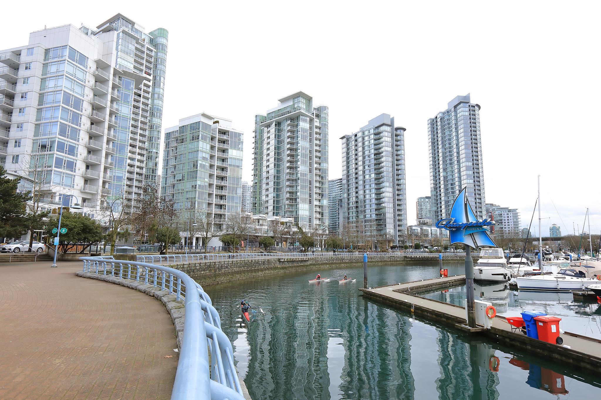 The seawall at the foot of the building, the marina beside it and the Yaletown towers running back from the water.