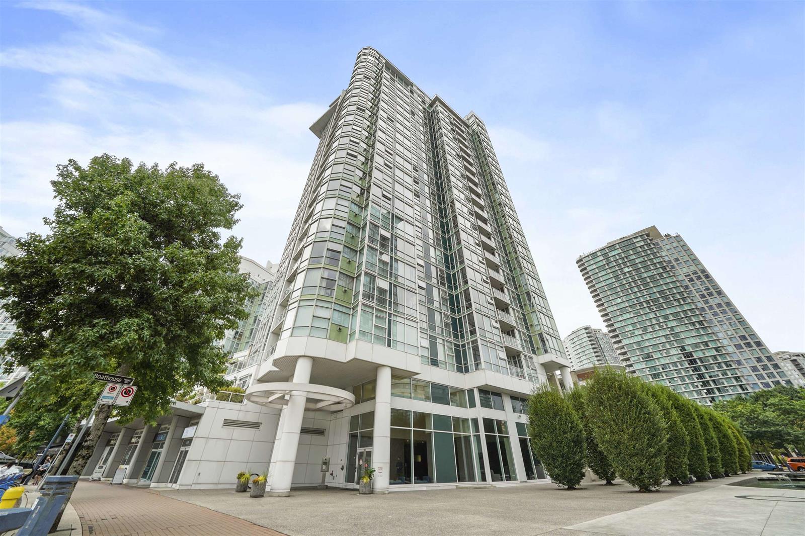 The tower from the street, rising above its glass podium on Marinaside Crescent.