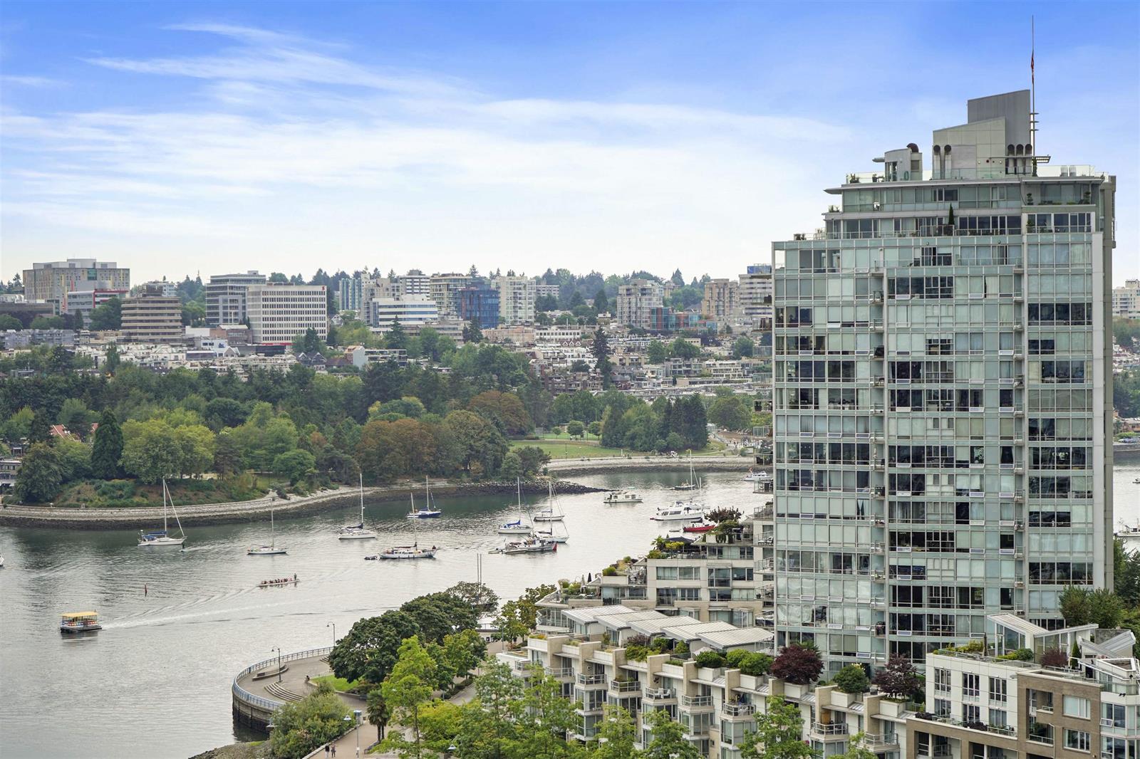 The building from over the water, the marina and False Creek below it with the West End beyond.