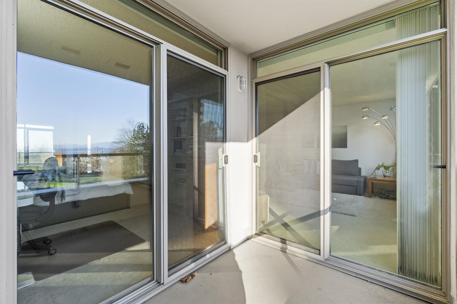 The balcony looking back into the home through the sliding doors.