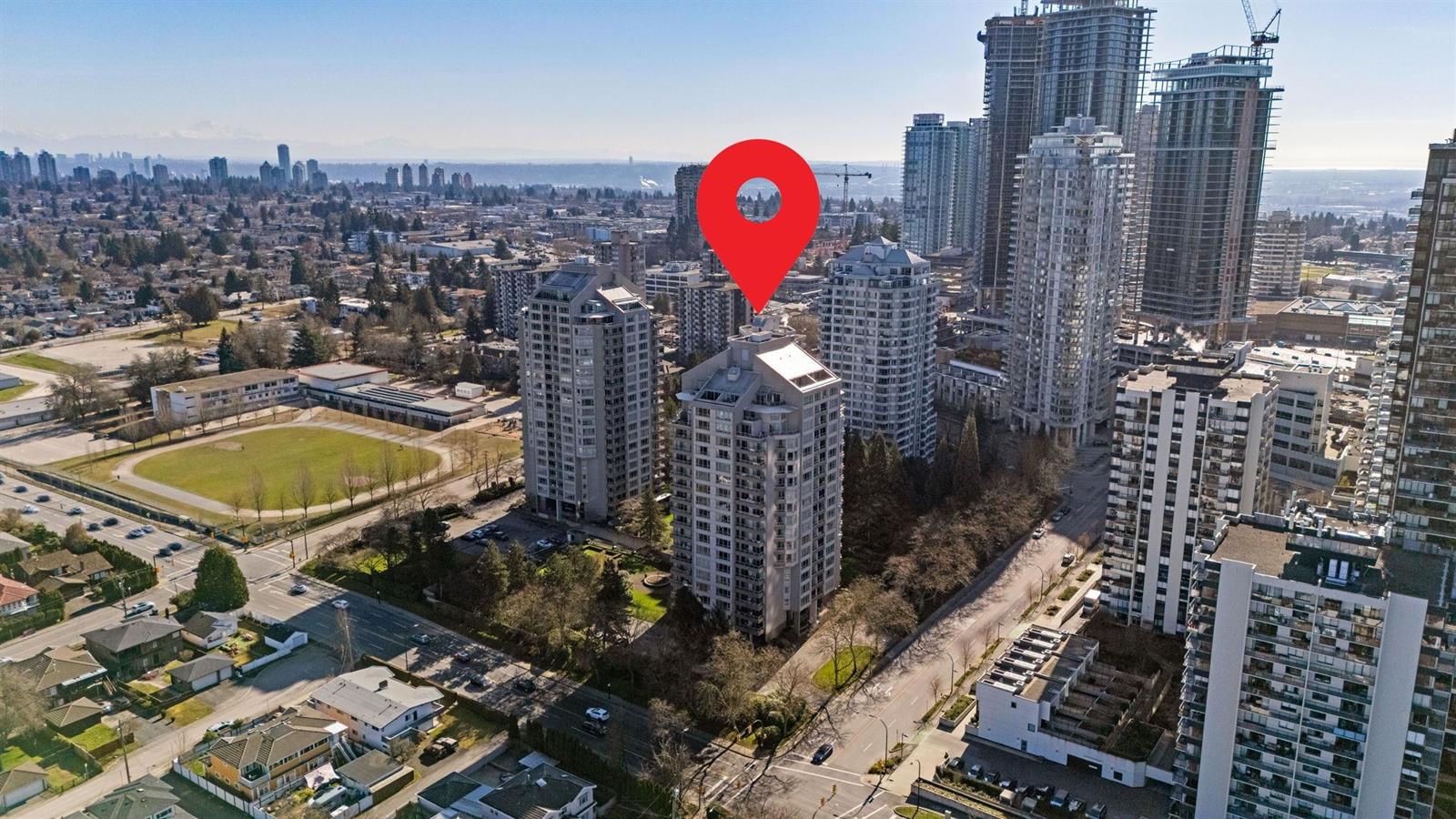 An aerial view looking toward Metrotown, the building in the foreground and the towers beyond.