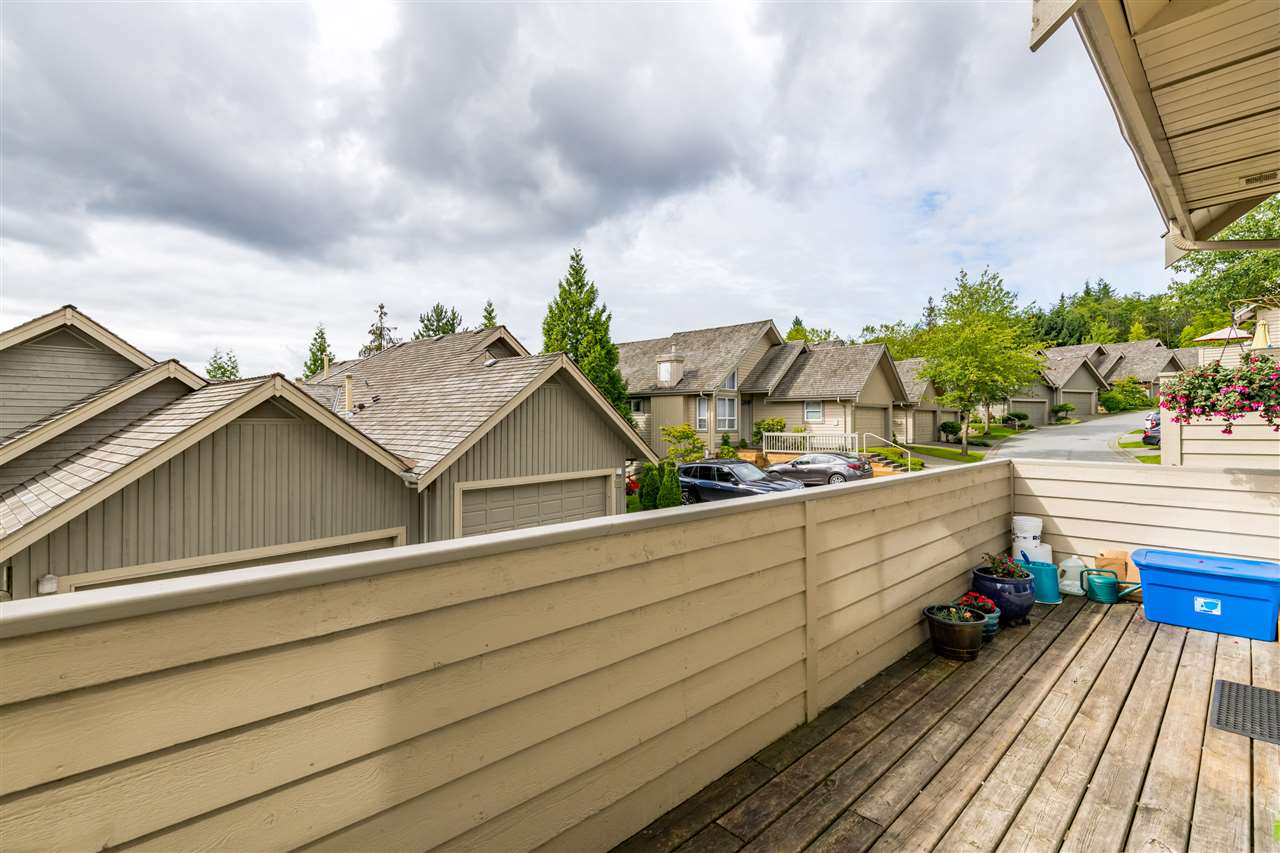 The deck off the main floor, fenced on both sides.