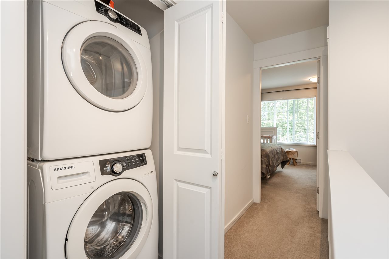 The laundry, a stacked washer and dryer in their own closet off the hall.