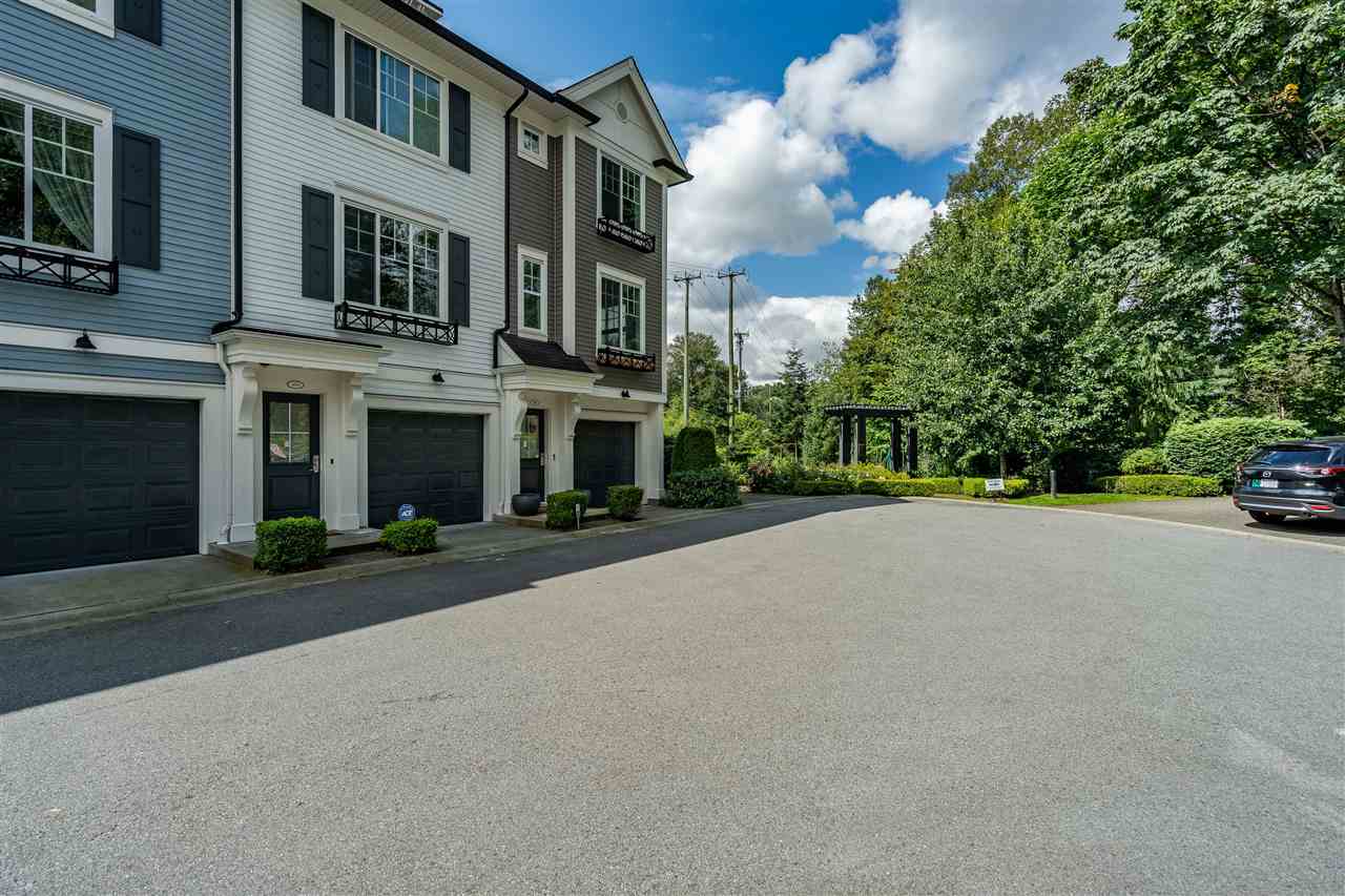 The lane through the complex, garage doors along one side.