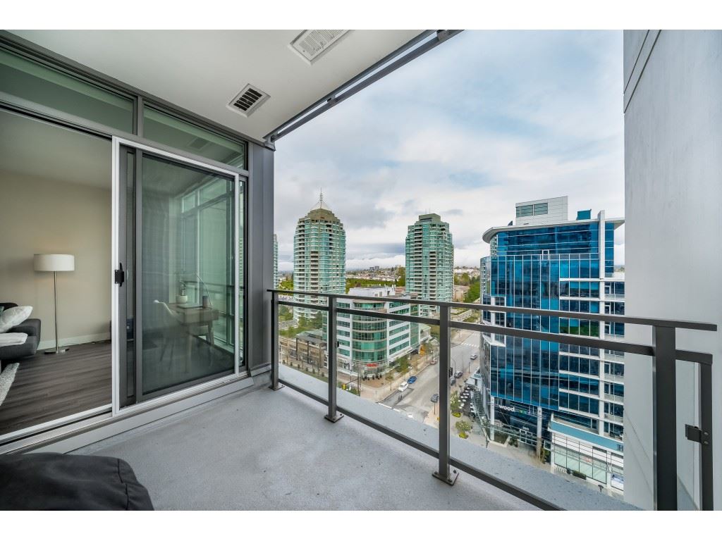 The balcony, the sliding door on one side and the rail with the towers past it.