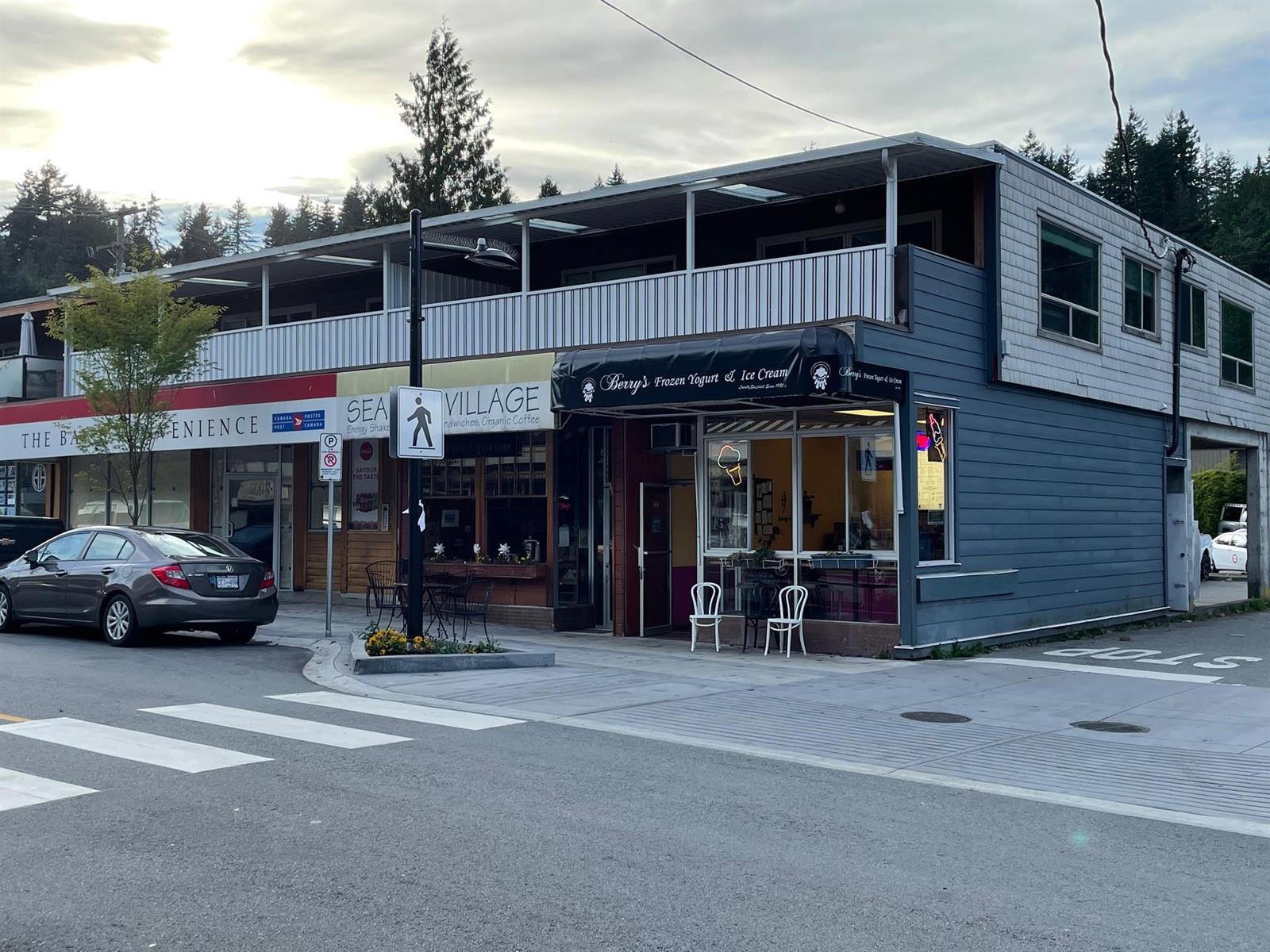 The building on the corner of Royal Avenue, shops along the street front and a covered deck running the length of the floor above.