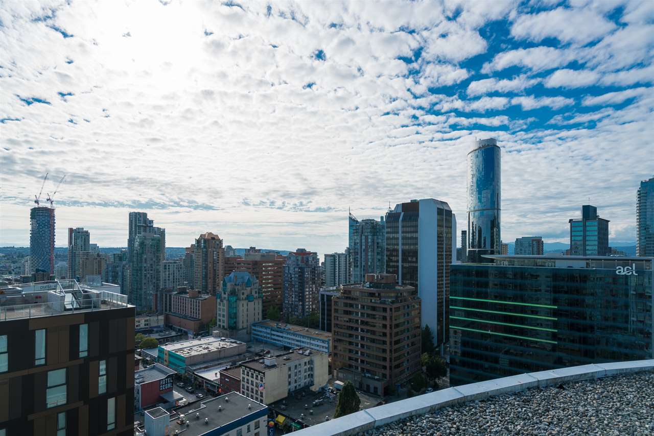 Looking out from the roof across downtown to the North Shore mountains.