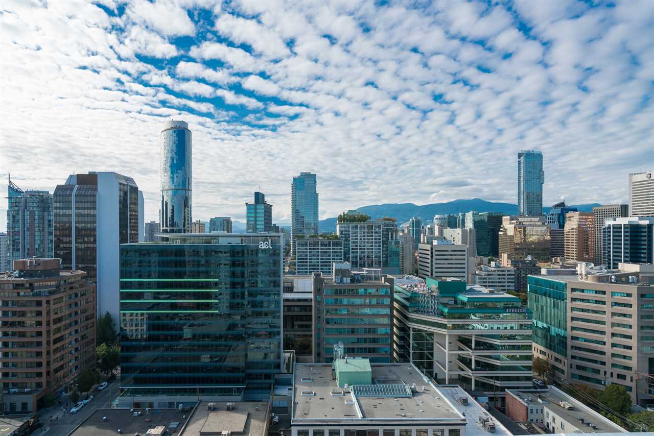 The downtown towers and the mountains beyond, seen from the terrace.