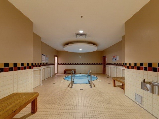 The hot tub room, a sunken tub set in tile under a domed ceiling.